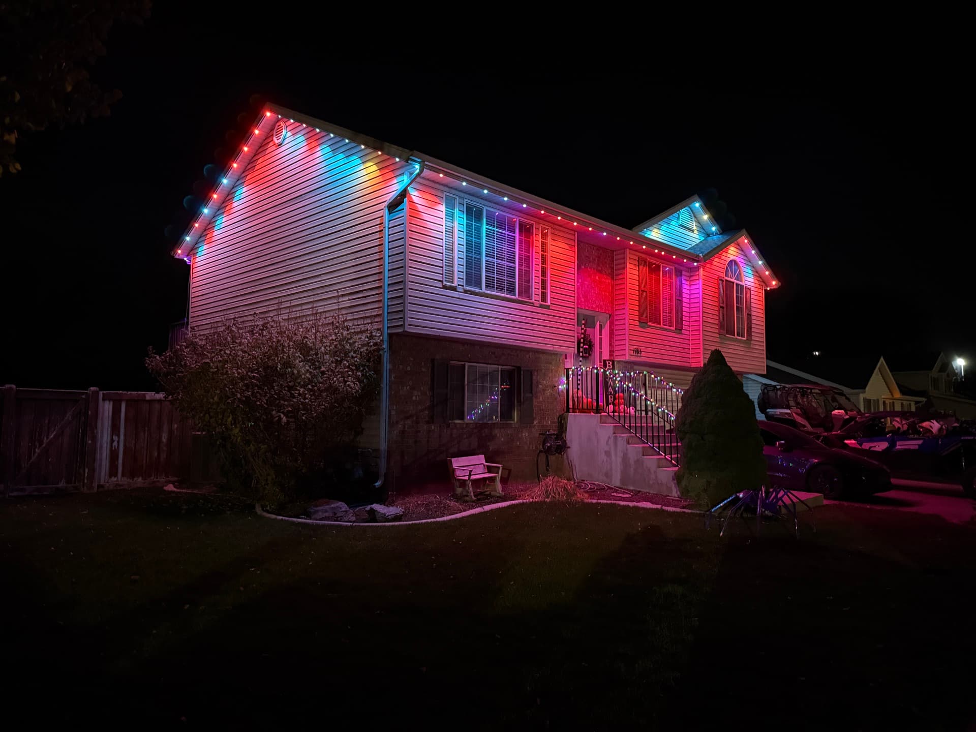 Home with permanent LED lights displaying colorful multicolor pattern